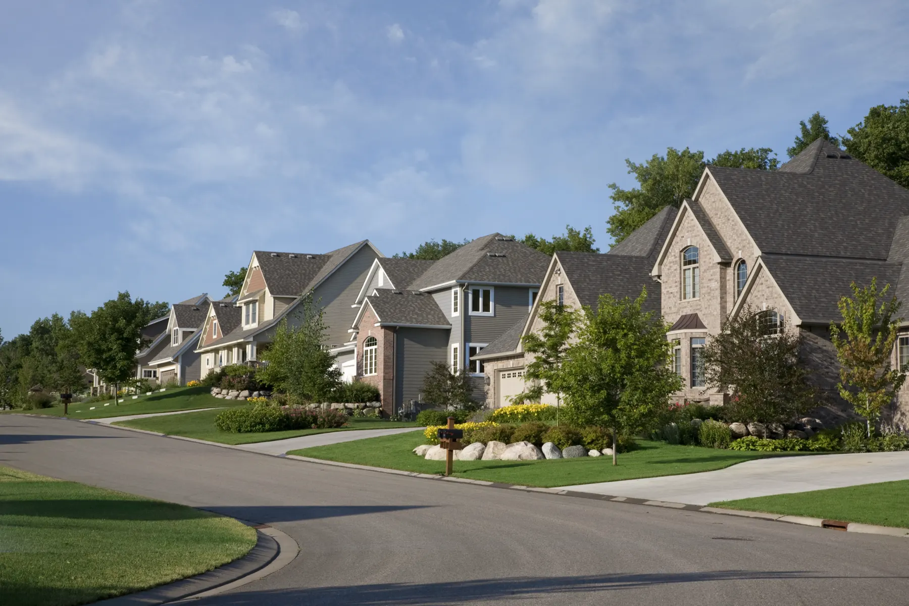 A suburban street lined with homes